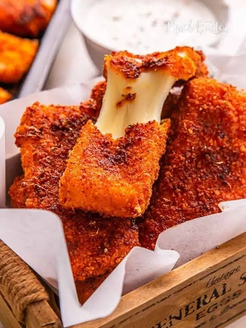 Nashville style mozzarella sticks served with hot dogs