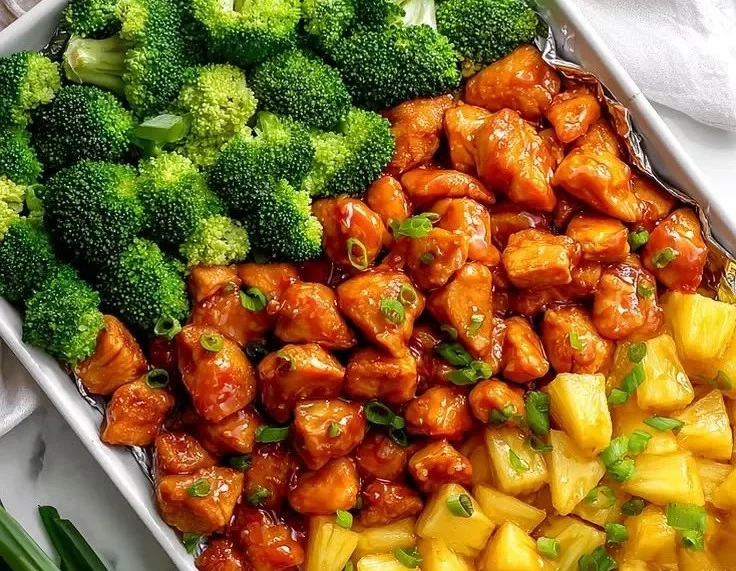 Sheet pan teriyaki chicken with pineapple and broccoli ready to serve