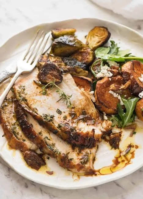 Easy Thanksgiving Turkey Breast cooked with garlic herb butter for holiday feast