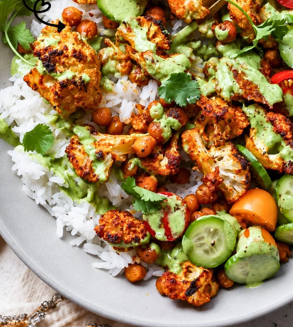 Healthy cauliflower shawarma bowls with colorful vegetables and toppings
