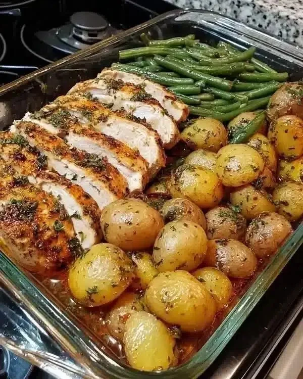 One-skillet chicken and potatoes dish garnished with herbs