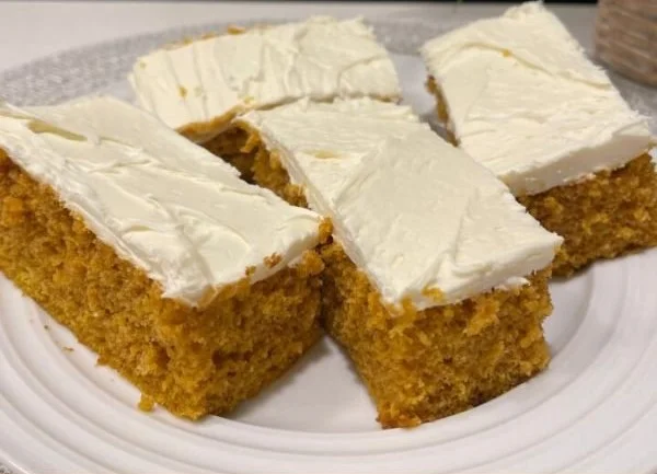 Delicious pumpkin cream cheese bars topped with spices and cream cheese frosting