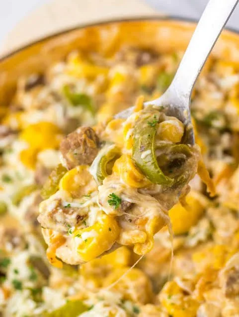 Easy cheesy steak tortellini casserole served in a bowl