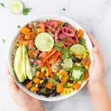 Sweet Potato and Black Bean Quinoa Bowls topped with fresh ingredients